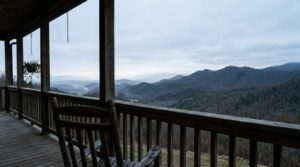 Empty rocking chair on a foggy mountain porch at dawn, symbolizing the quiet season after facing a denial before a diagnosis